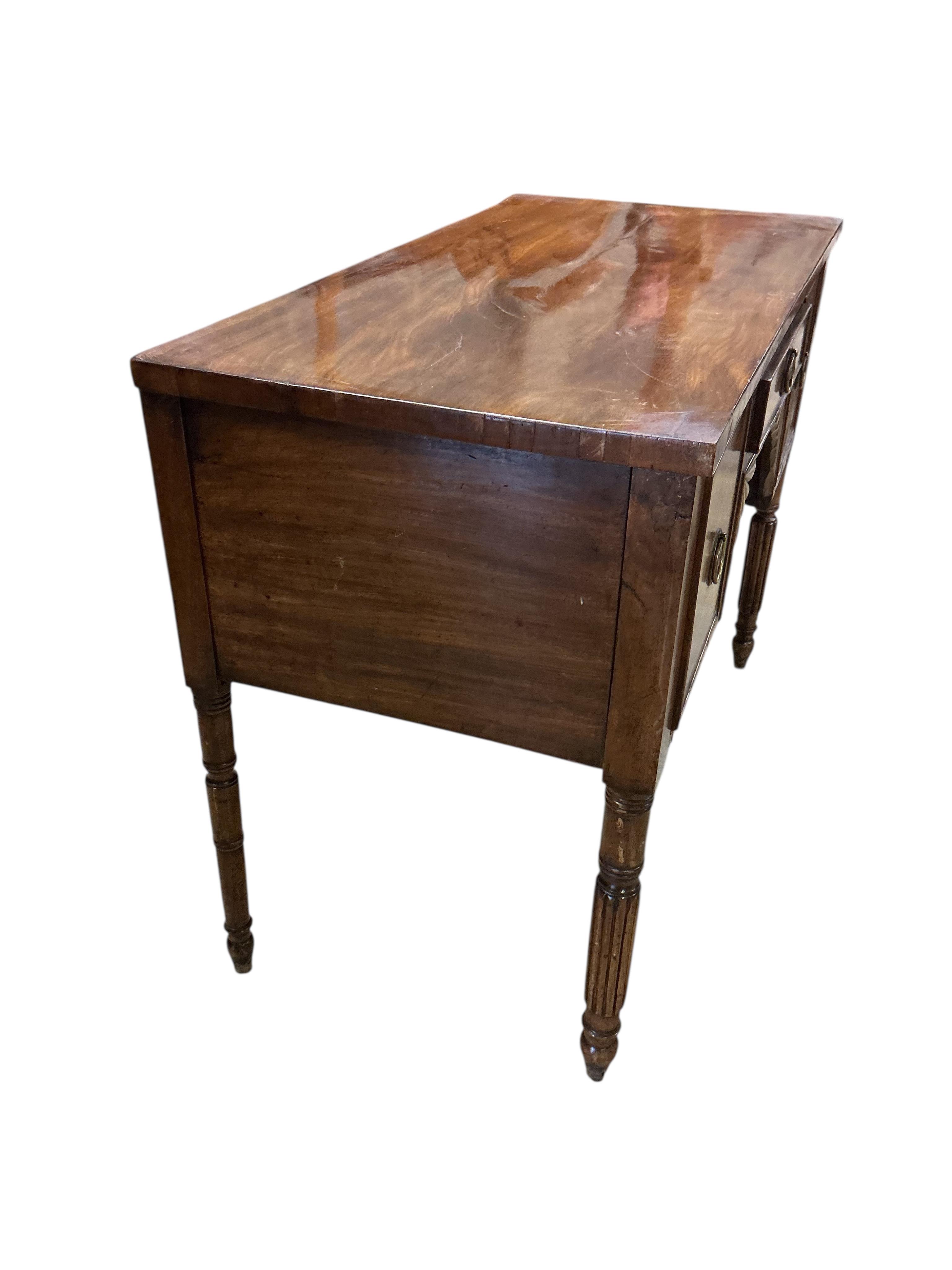 A Regency mahogany kneehole dressing table, width 94cm, depth 47cm, height 72cm